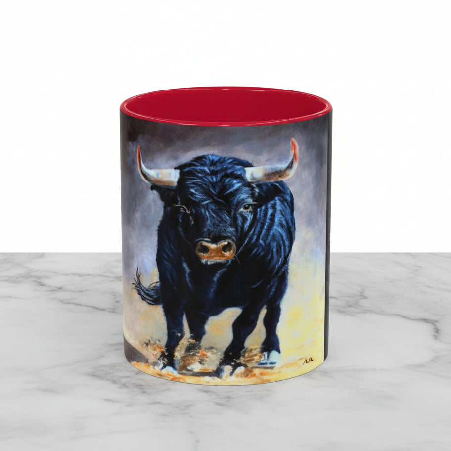 A ceramic mug featuring a wrap-around print of two black bulls with a solid red interior and and C handle 11oz