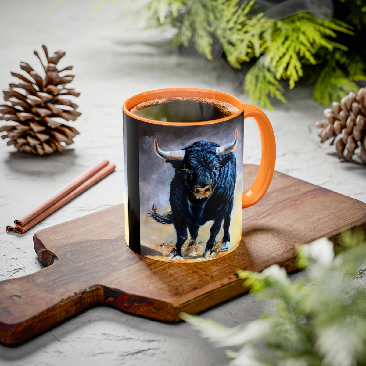 A ceramic mug with an golden yellow interior and handle featuring a painted illustration of a black bull. 11oz 