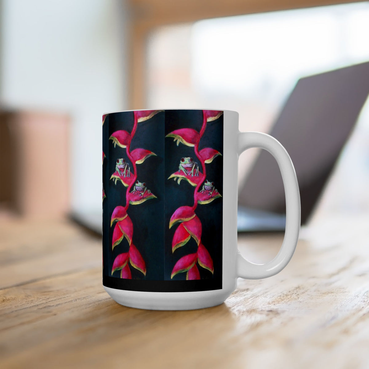 15 oz white ceramic mug with a repeating pattern of pink Heliconia plants and green frogs on a black background