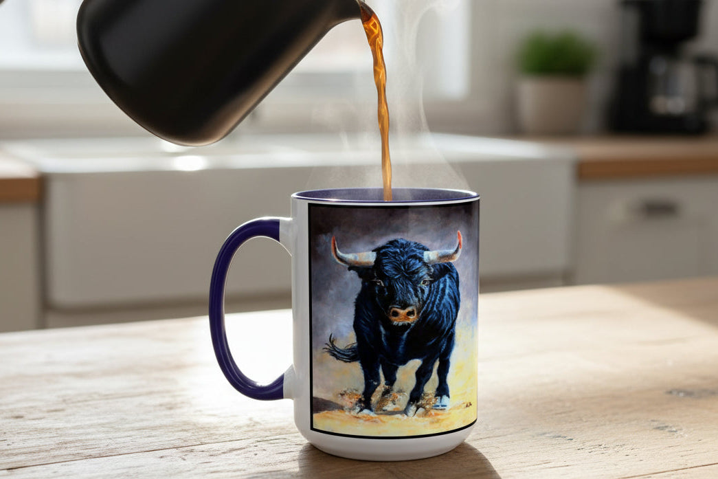 15 oz size ceramic mug of painted charging  bull design with blue accents on C Handle and Interior