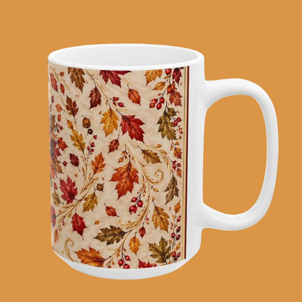 A white ceramic mug featuring a detailed autumn leaf pattern in shades of red, orange, and brown on a beige background, shown against a plain white studio background.