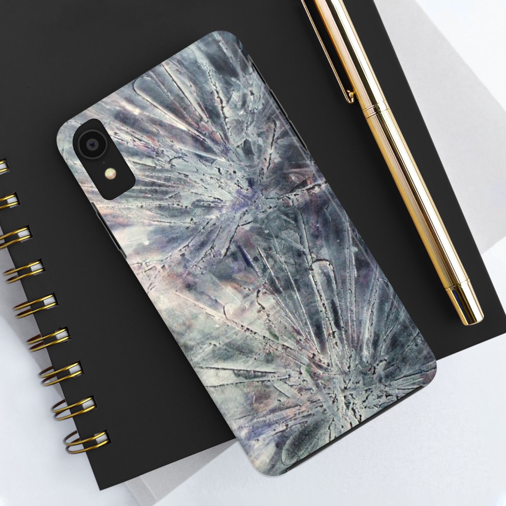 Phone case in abstract bursts of silver crystal design with rubber lining for strong impact and UV protection