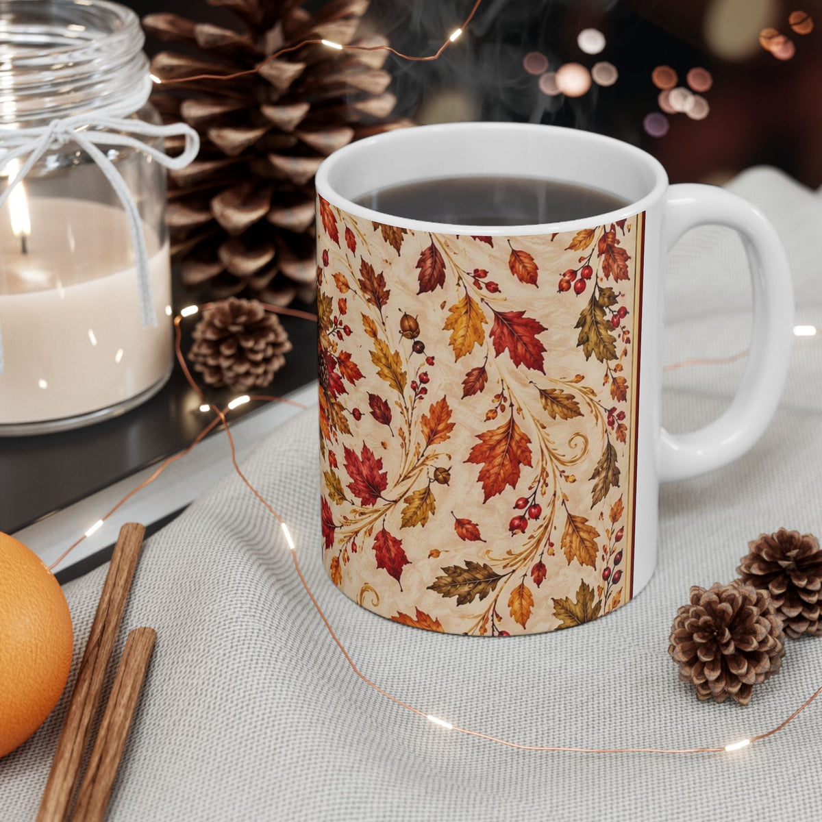 A white ceramic mug with a beige autumn leaf pattern of colorful drifting autumn leaves
