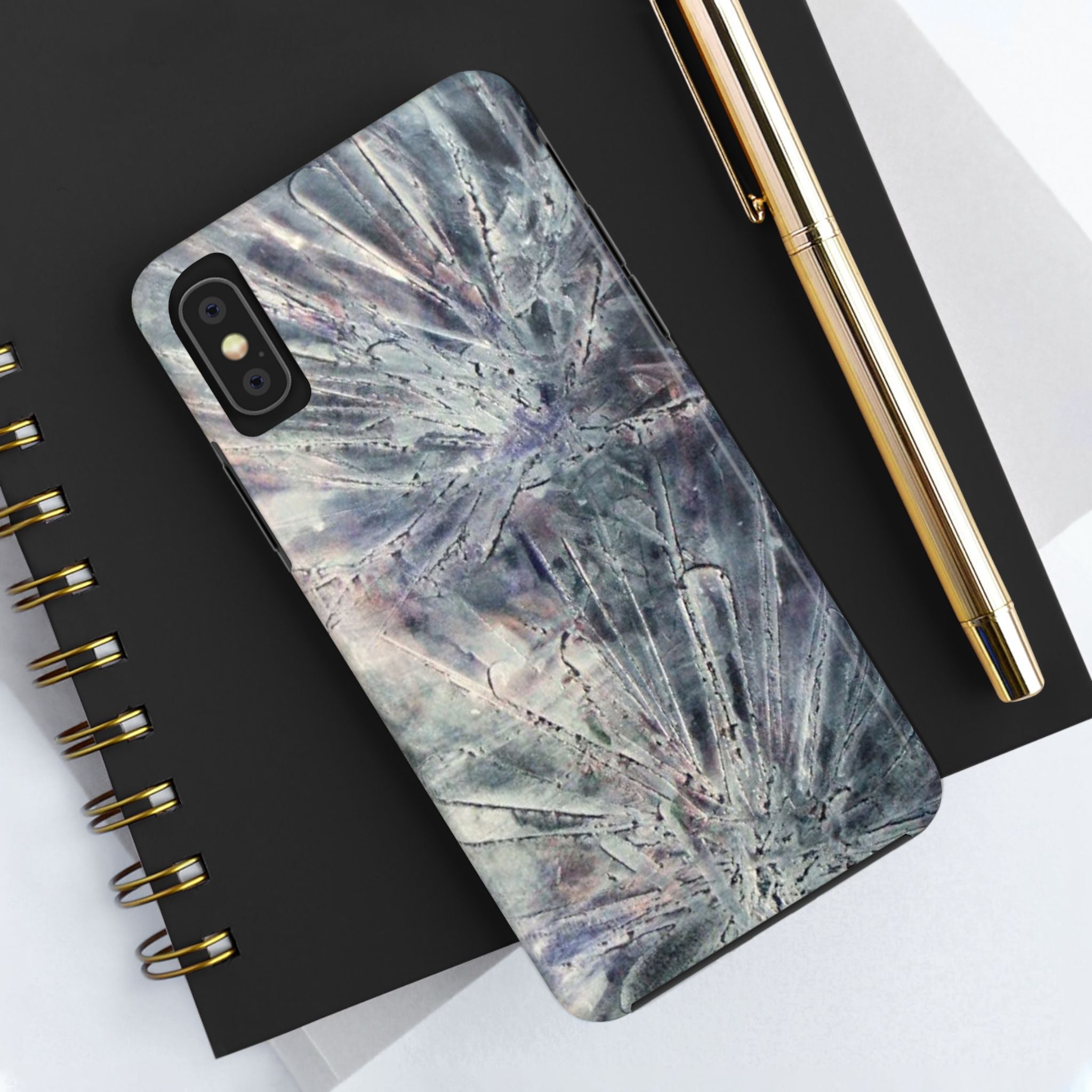 Phone case in abstract bursts of silver crystal design with rubber lining for strong impact and UV protection