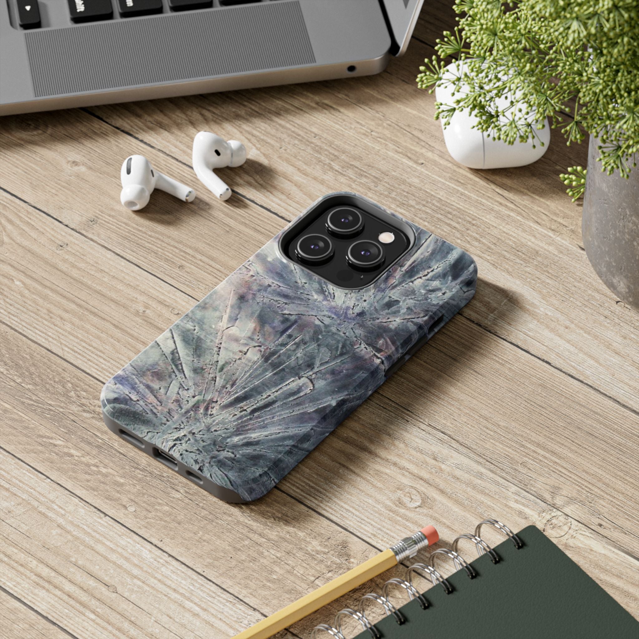 Phone case in abstract bursts of silver crystal design with rubber lining for strong impact and UV protection