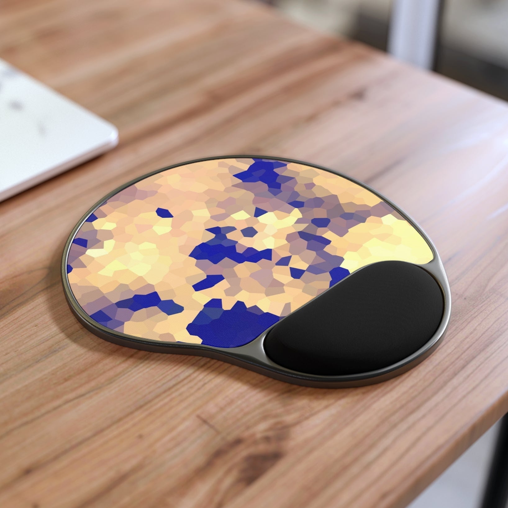 Mouse pad with wrist support on a wooden desk