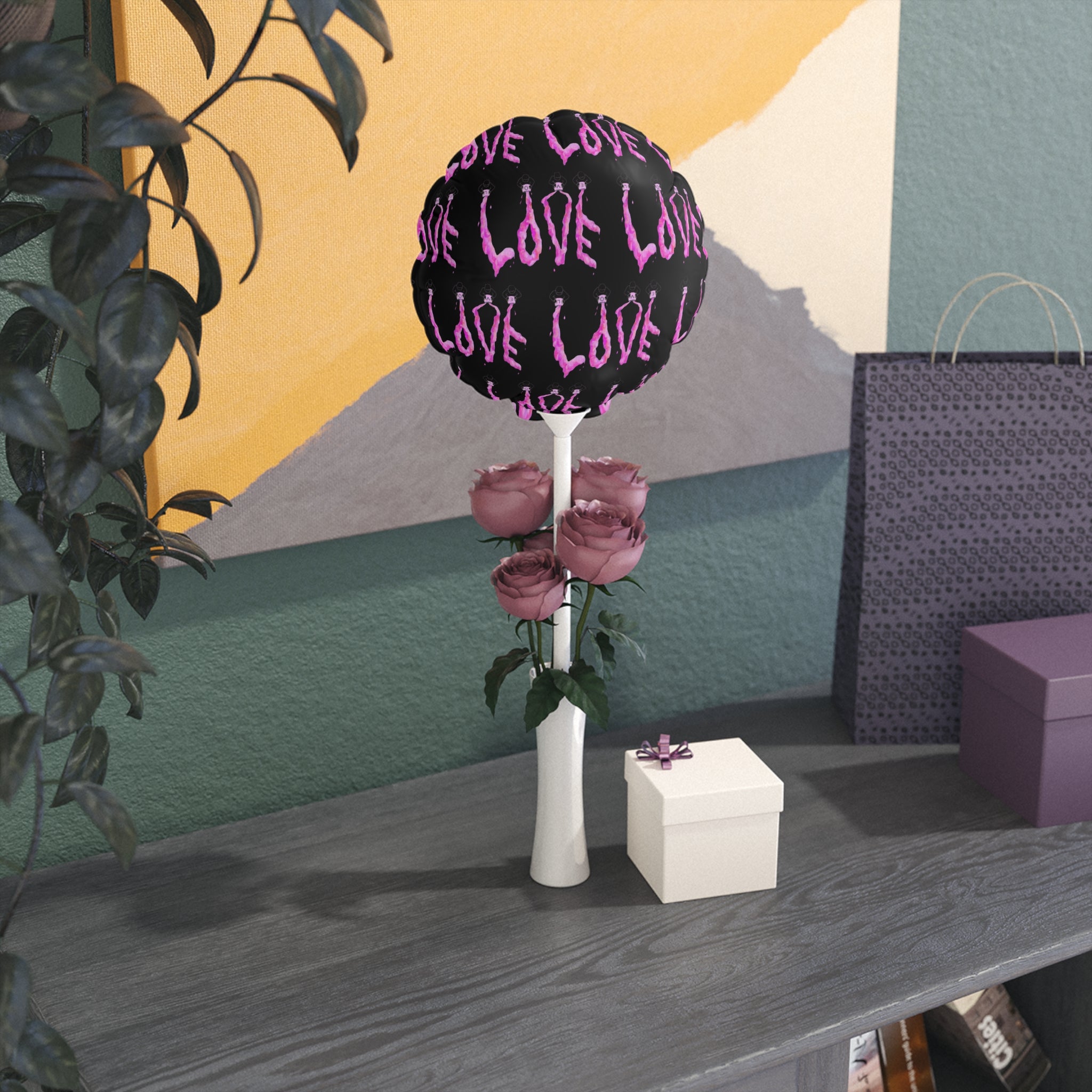 Decorative balloons with 'LOVE' text and flowers 