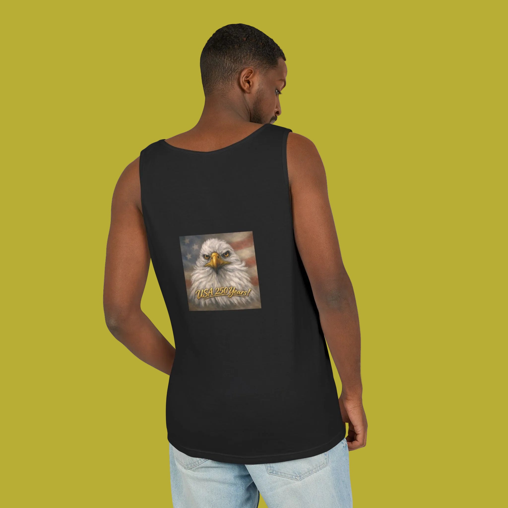 Person wearing a black tank top with an eagle painting on the back