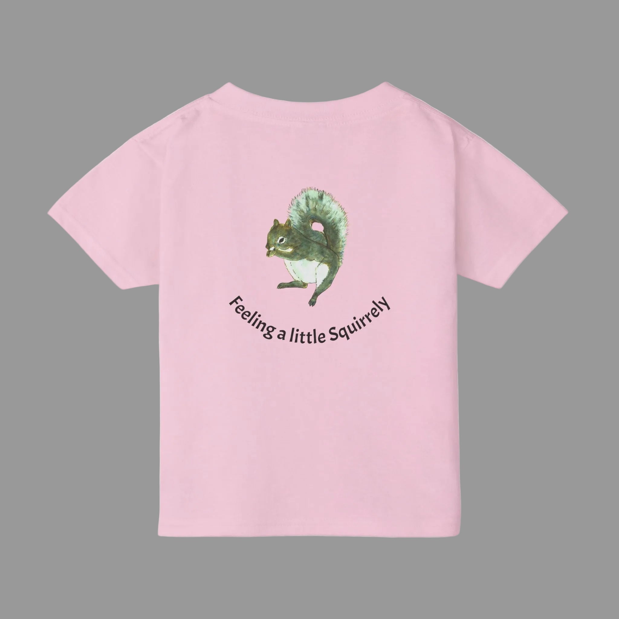A light pink short-sleeve t-shirt shown from the back, featuring a painted squirrel graphic  with the text 'Feeling a little Squirrelly'