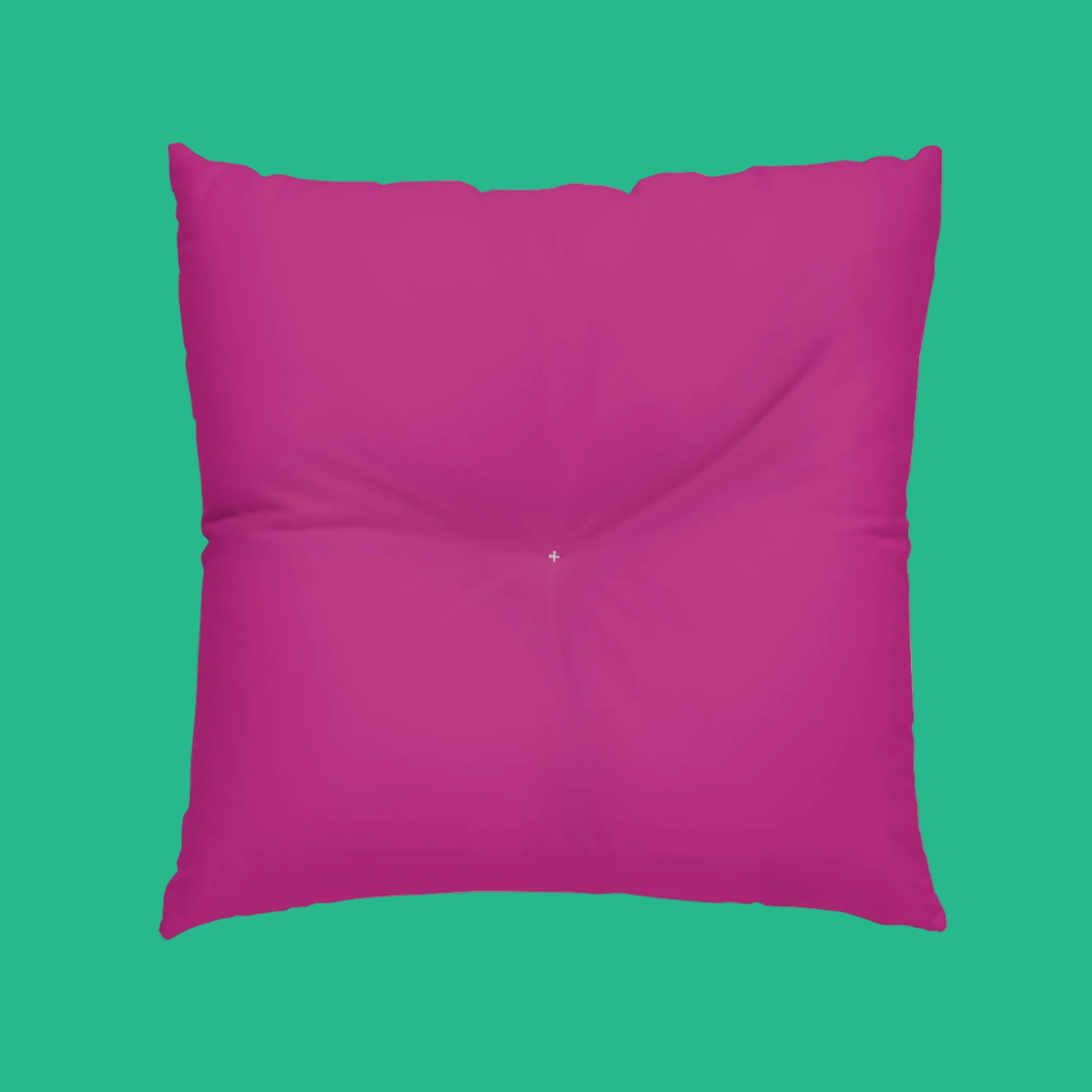 Back side of abstract floor pillow in solid fuchsia