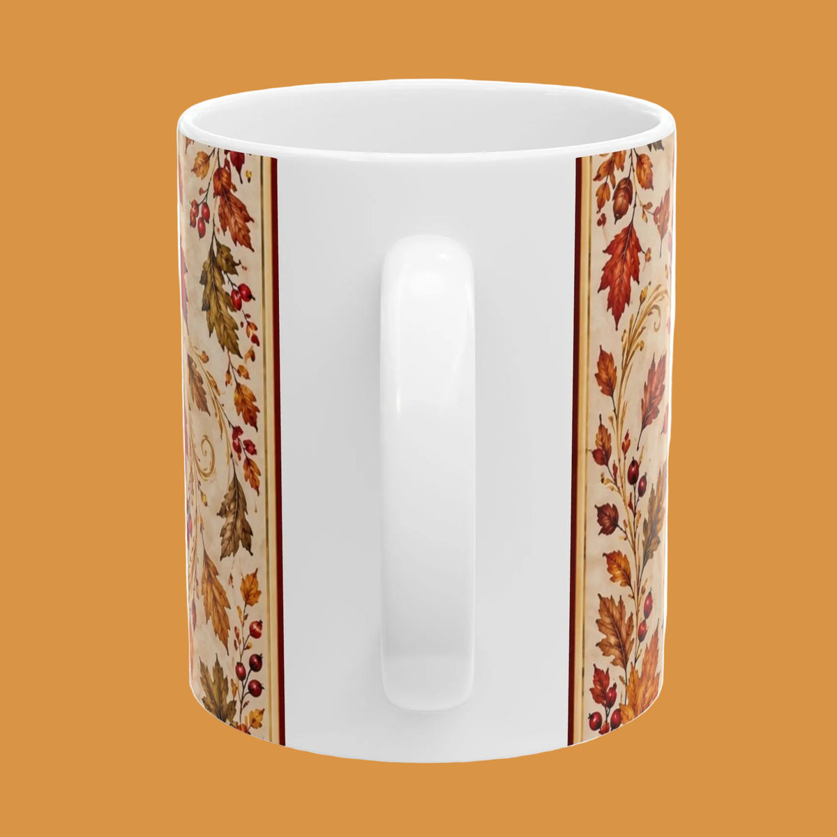 A white ceramic mug featuring a decorative autumn leaf pattern printed on the sides, shown against a plain white background.