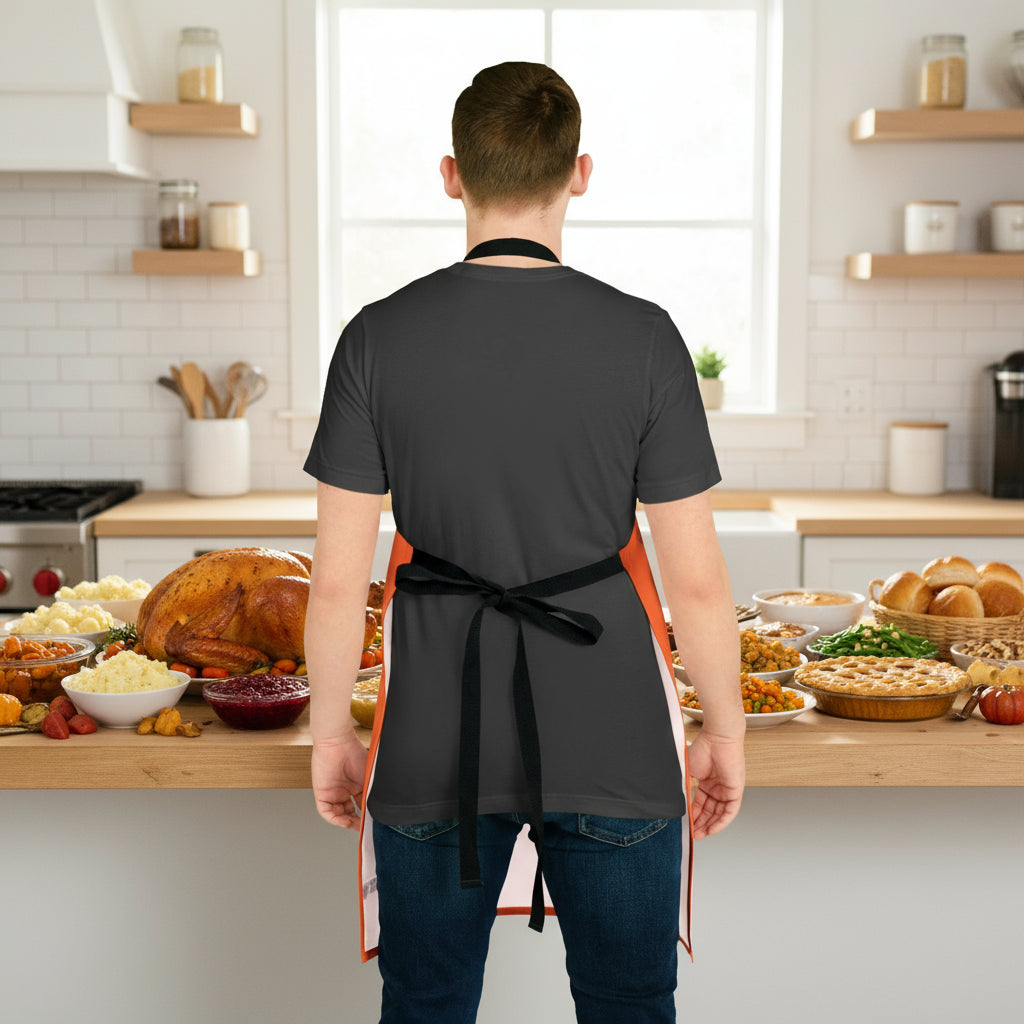 Person wearing holiday apron with black ties - orange and colorful front 