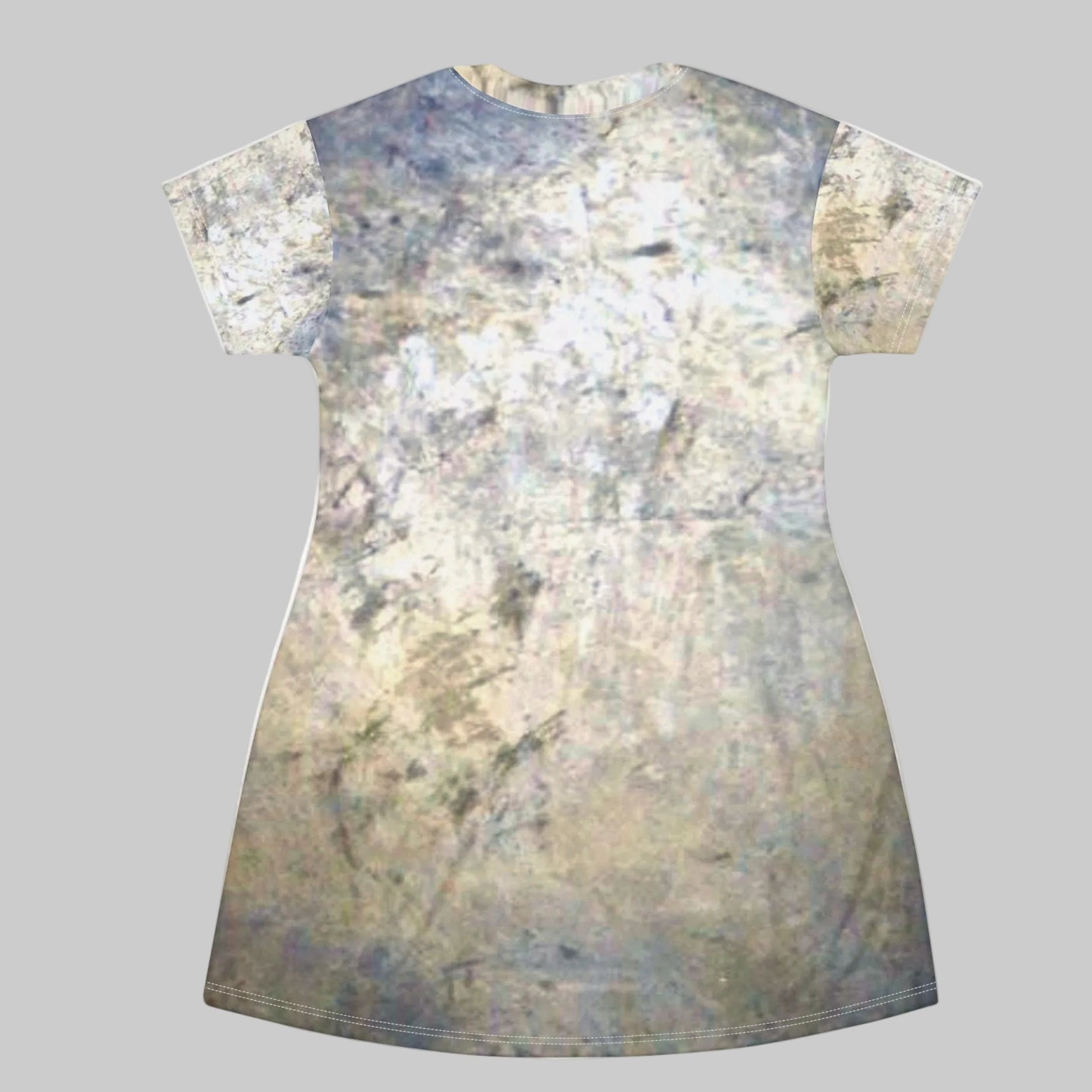 A short-sleeve t-shirt dress with an all-over abstract distressed print in shades of beige, gray, and muted blue