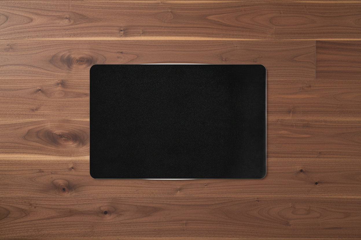 Black backside of  rectangular pet food mat  with rubber backing