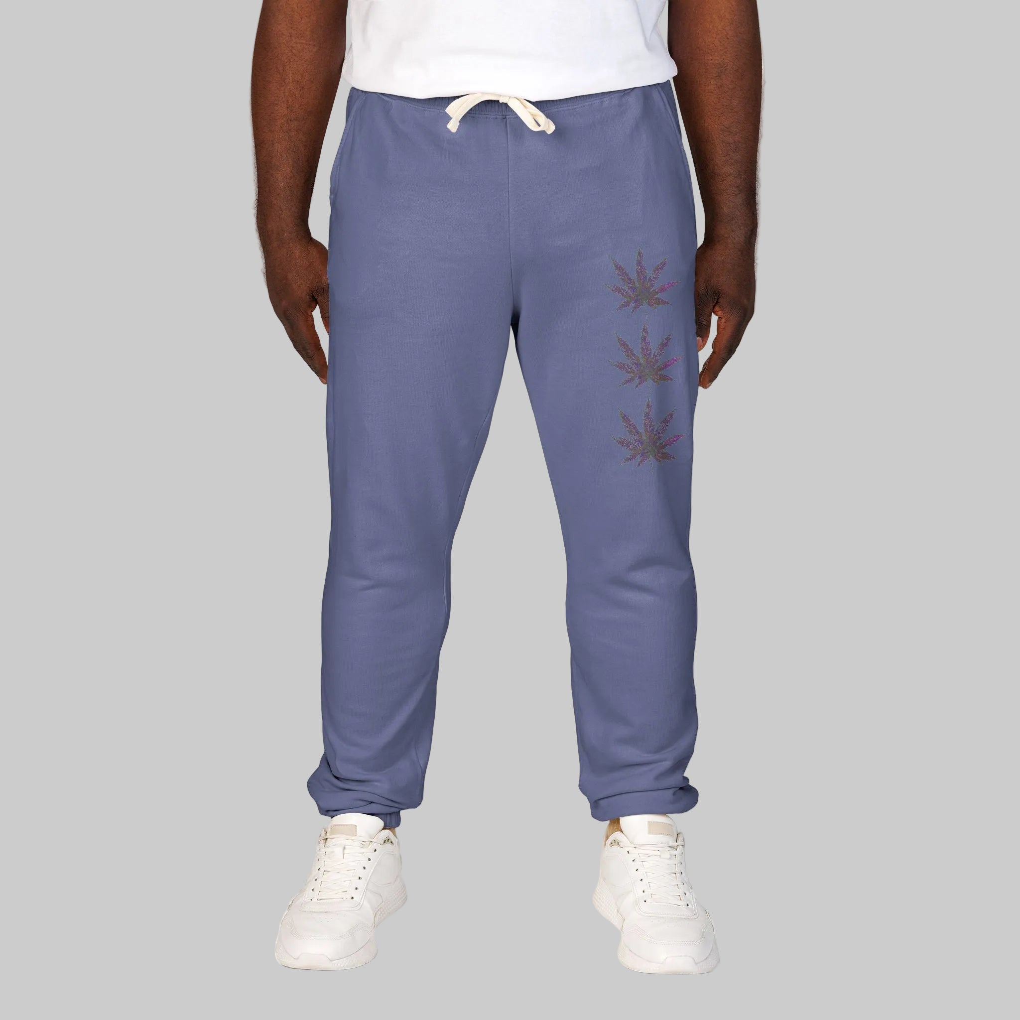 Blue Jean unisex sweatpants with a vertical graphic print of three cannabis leaves on the left leg for your statement.