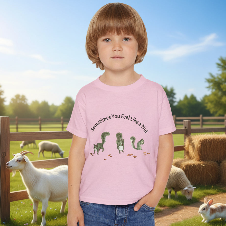 child's light pink t-shirt with a squirrely  graphic and the text 'Sometimes You Feel Like a Nut'