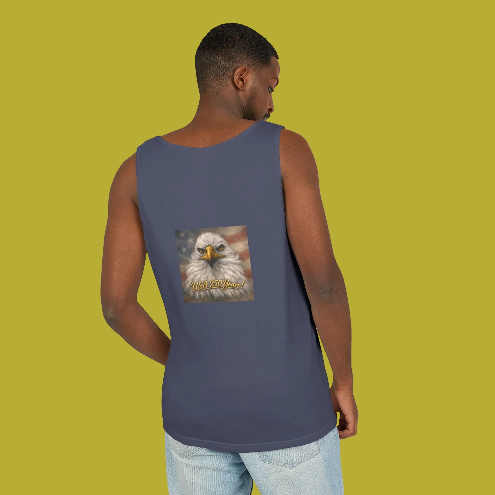 Person wearing a denim blue tank top with an eagle painting on the back