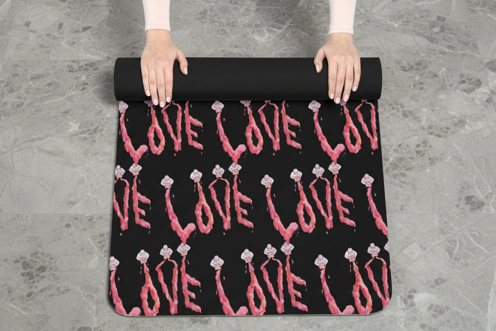 Black yoga mat with pink 'LOVE' comes with carrying strap