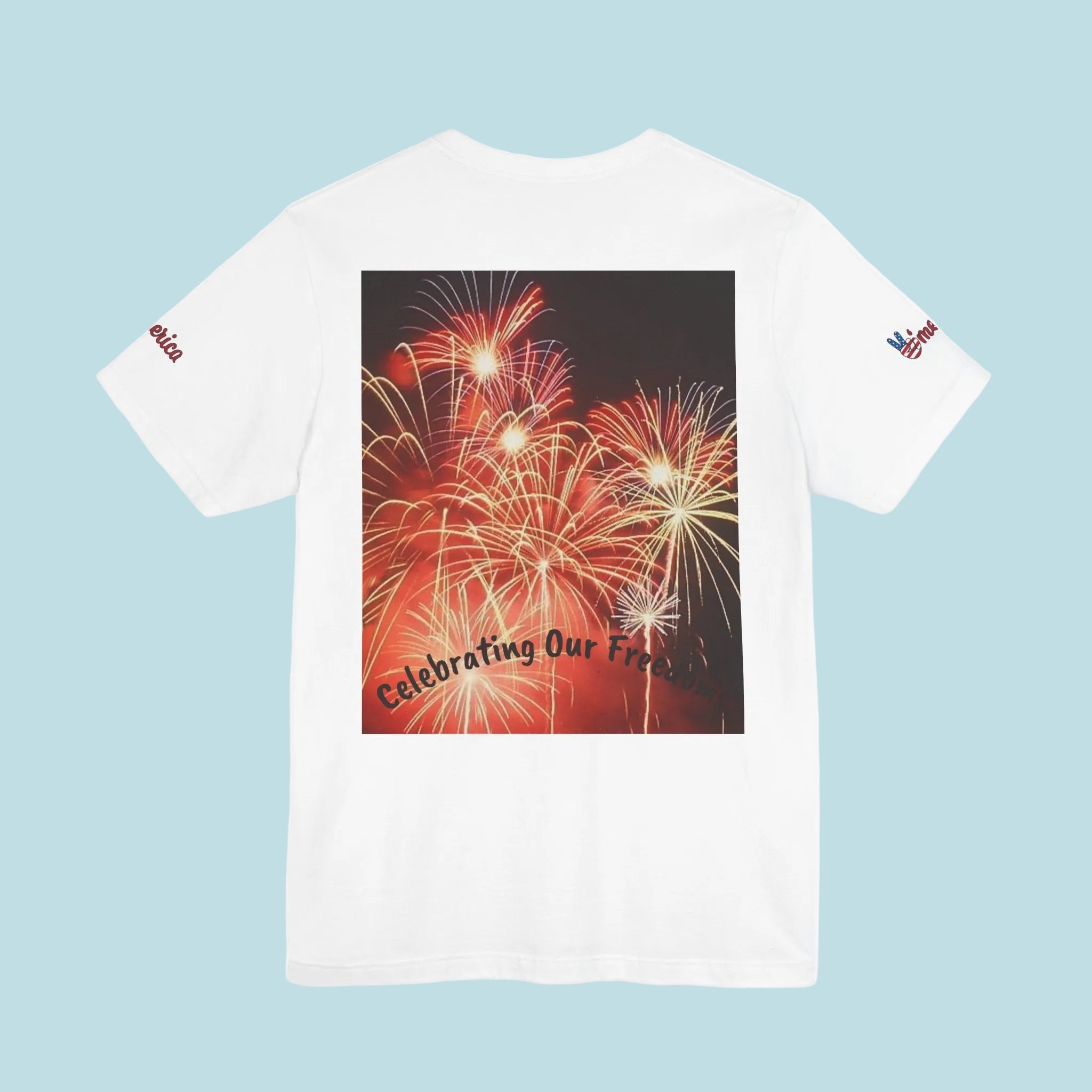 White t-shirt with a graphic of fireworks and text on the back