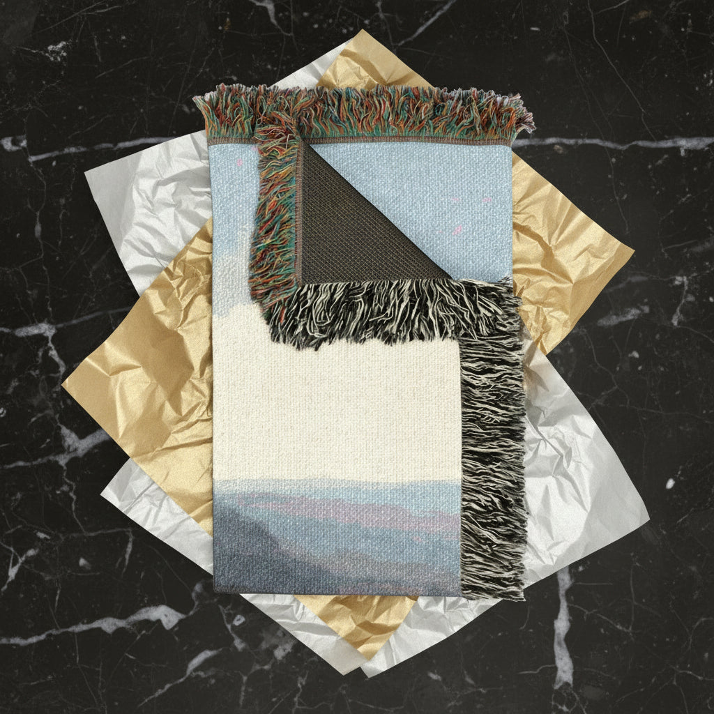 100% Cotton Woven throw blanket with fringed edges on wrapping paper