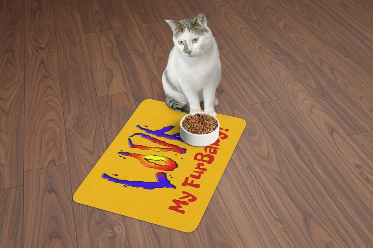 Cat sitting on a yellow mat with colorful text and a bowl of food.