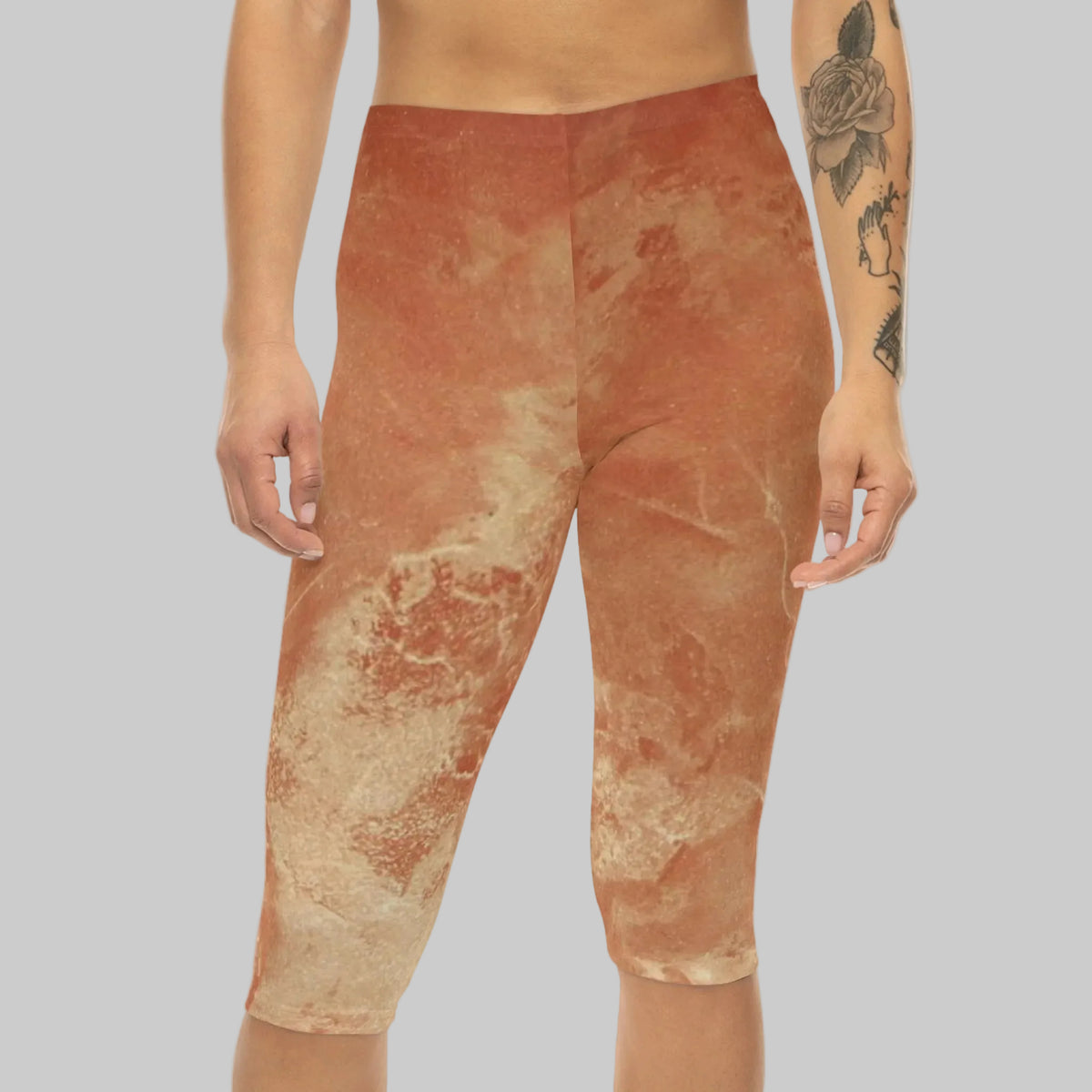 Capri leggings with an abstract mottled pattern in terracotta orange and beige