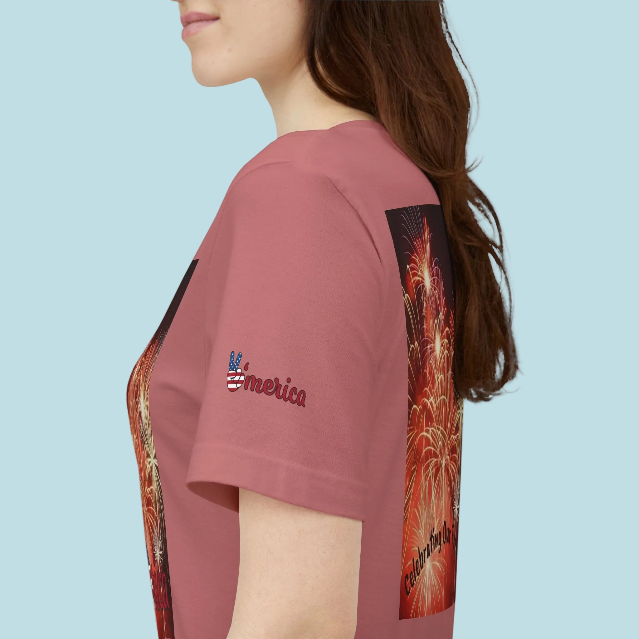 Mauve t-shirt with a graphic design and 'America' text on sleeve