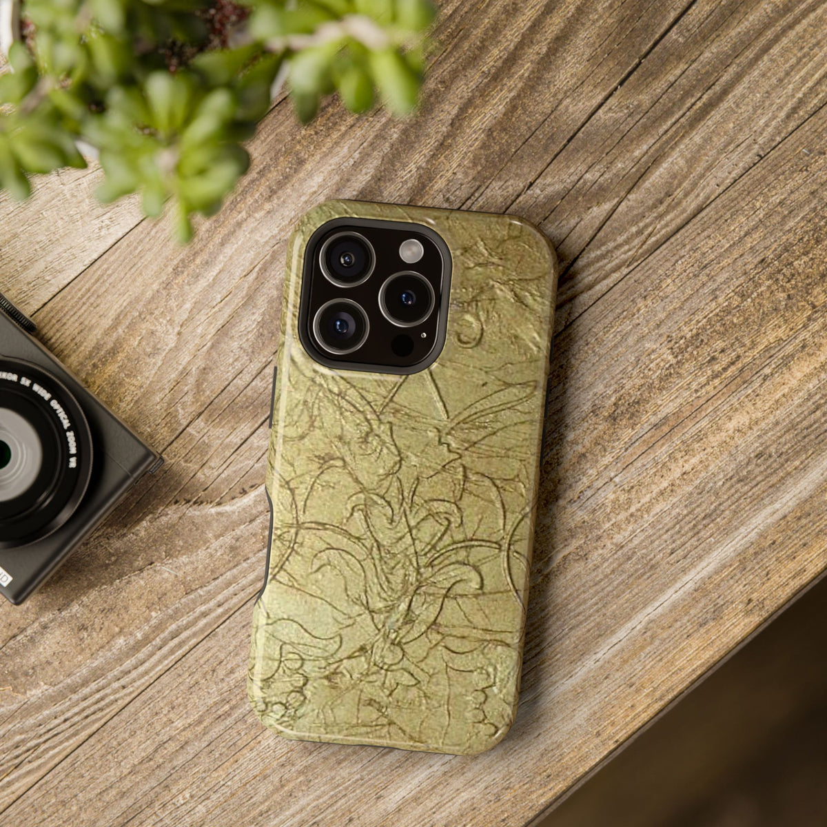 Phone case with swirling scroll design in glossy and matte finish in dual construction