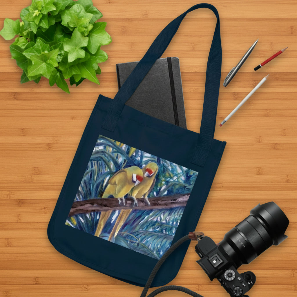 Navy blue tote bag features painted parrot tropical theme on both sides