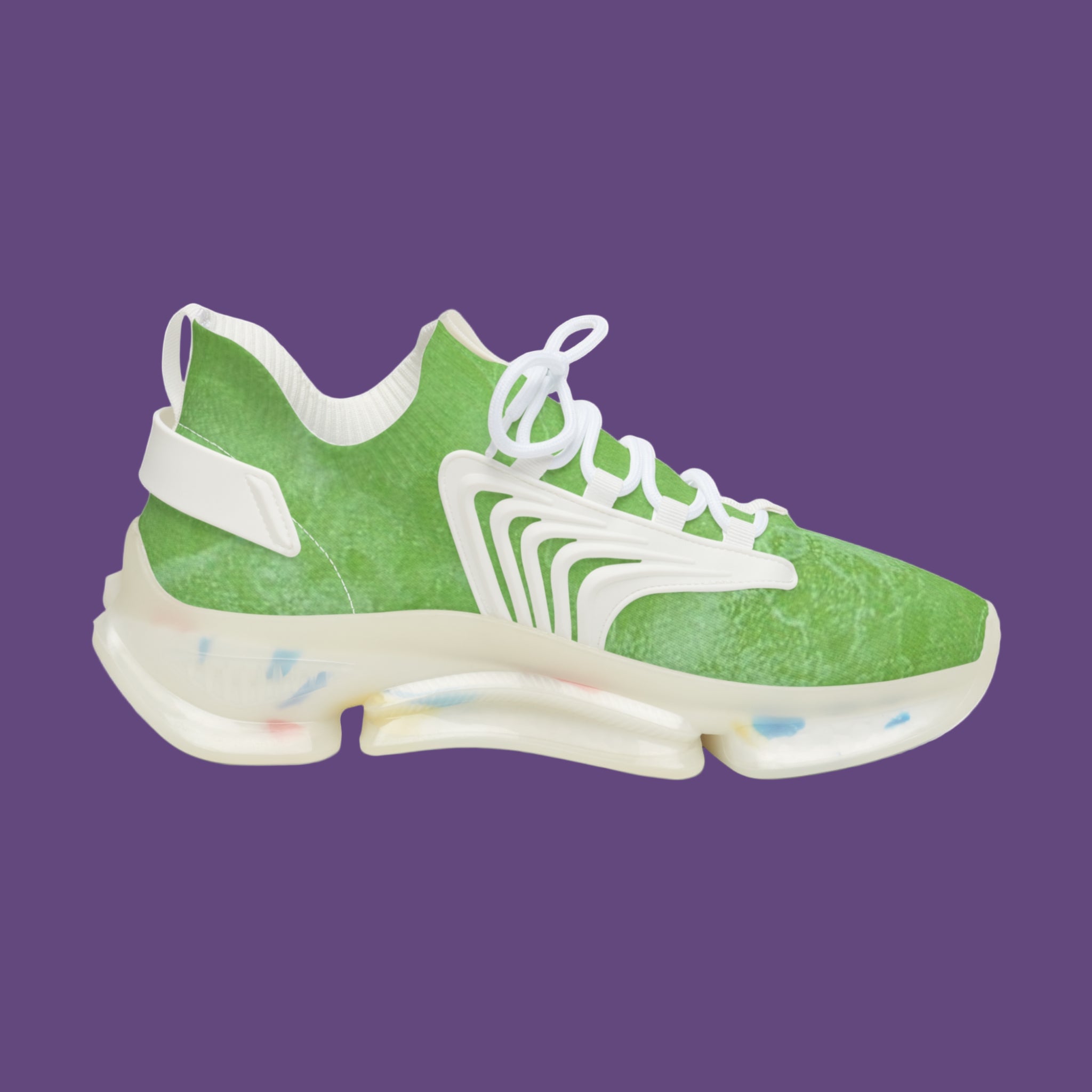 Green sneaker with white accents on a purple background