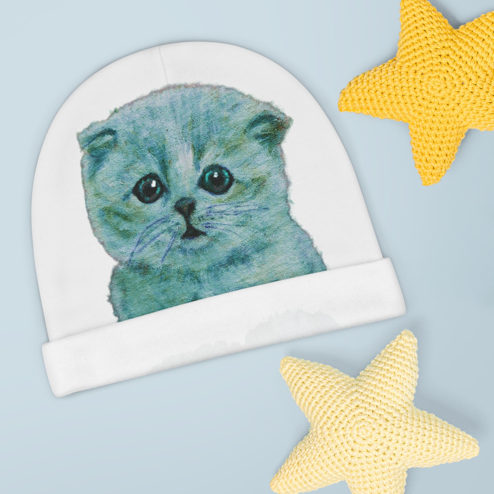 White beanie with a blue kitten design for baby and toddler - great gift