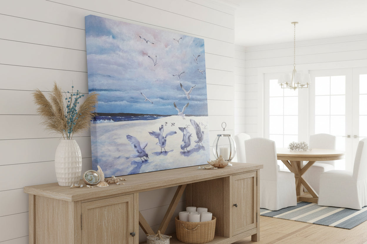 Canvas print of seagulls over a beach with a blue sky.
