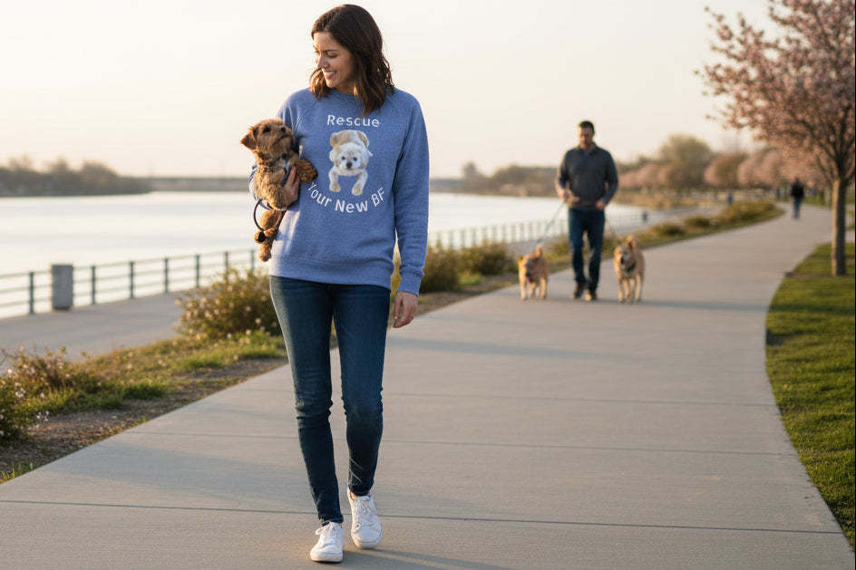 Woman in Raglan Heather Royal shirt with relaxed fit supports dog rescue