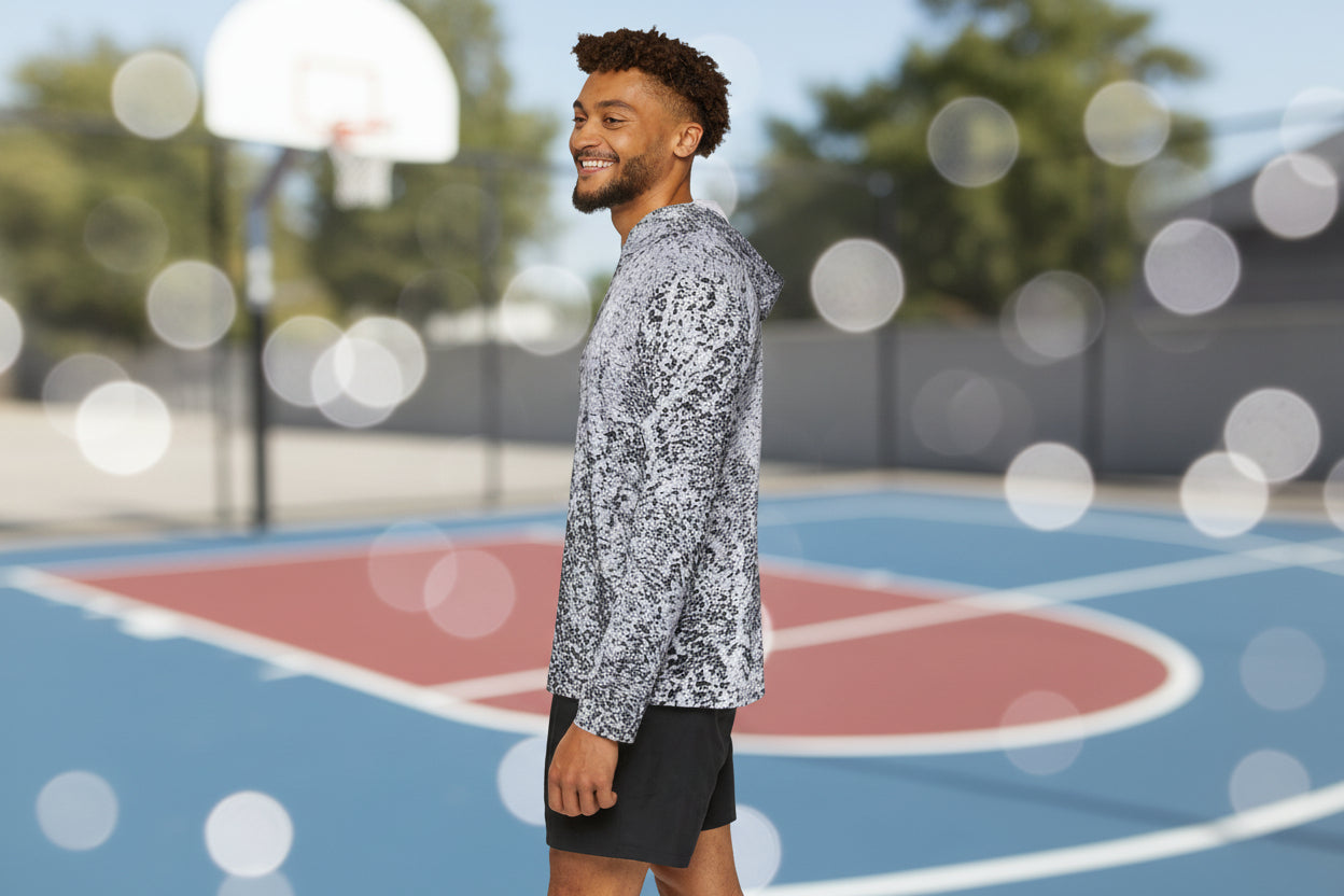 Man wearing an abstract design hoodie warm up top
