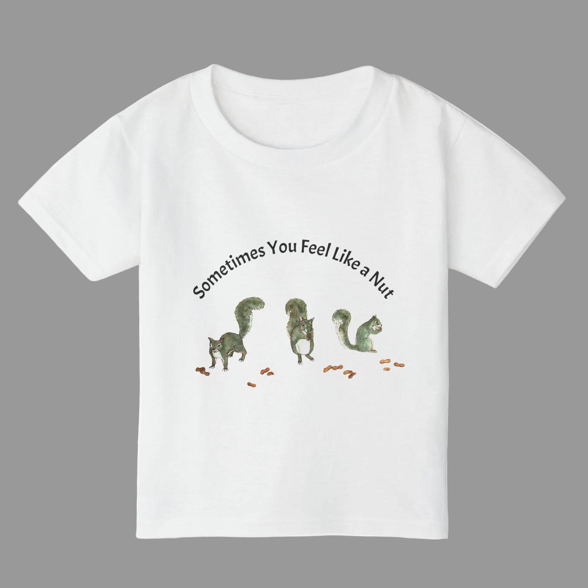 A white short-sleeve kids' t-shirt featuring a graphic of three squirrels and the text 'Sometimes You Feel Like a Nut' 
