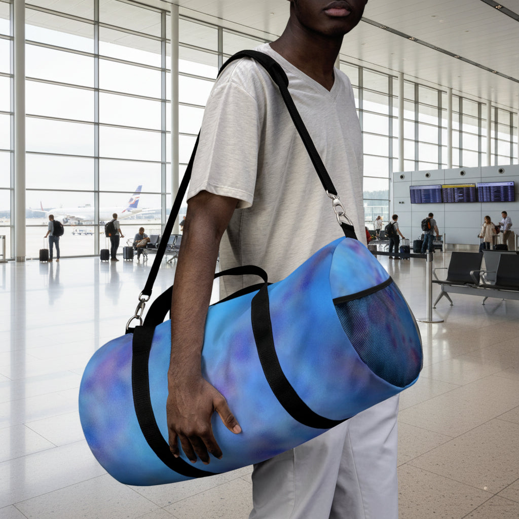 Abstract blue duffel bag in lengths 19 and 23 to accommodate everything you need to carry
