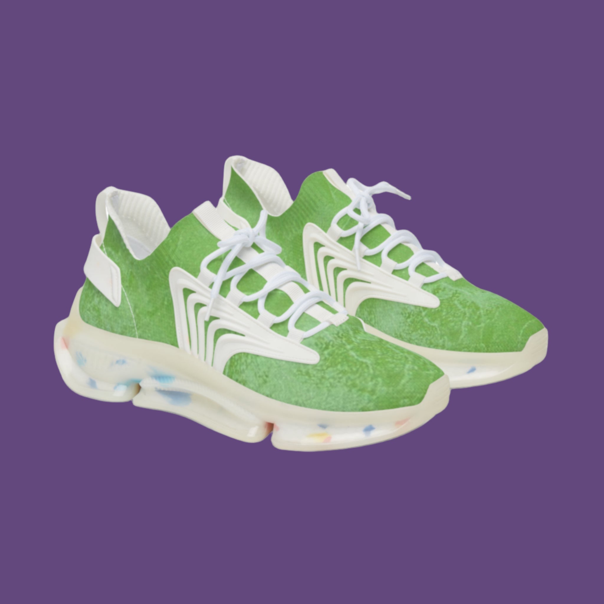 Green sneakers with white laces on a purple background