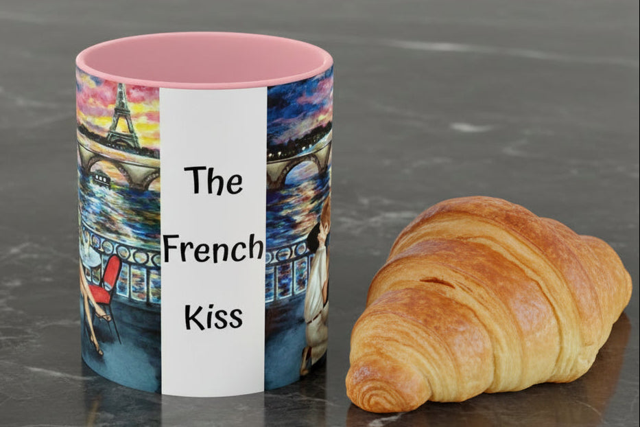Mug with 'The French Kiss' artist painting of a romantic couple by Eiffel Tower in pink interior and handle.