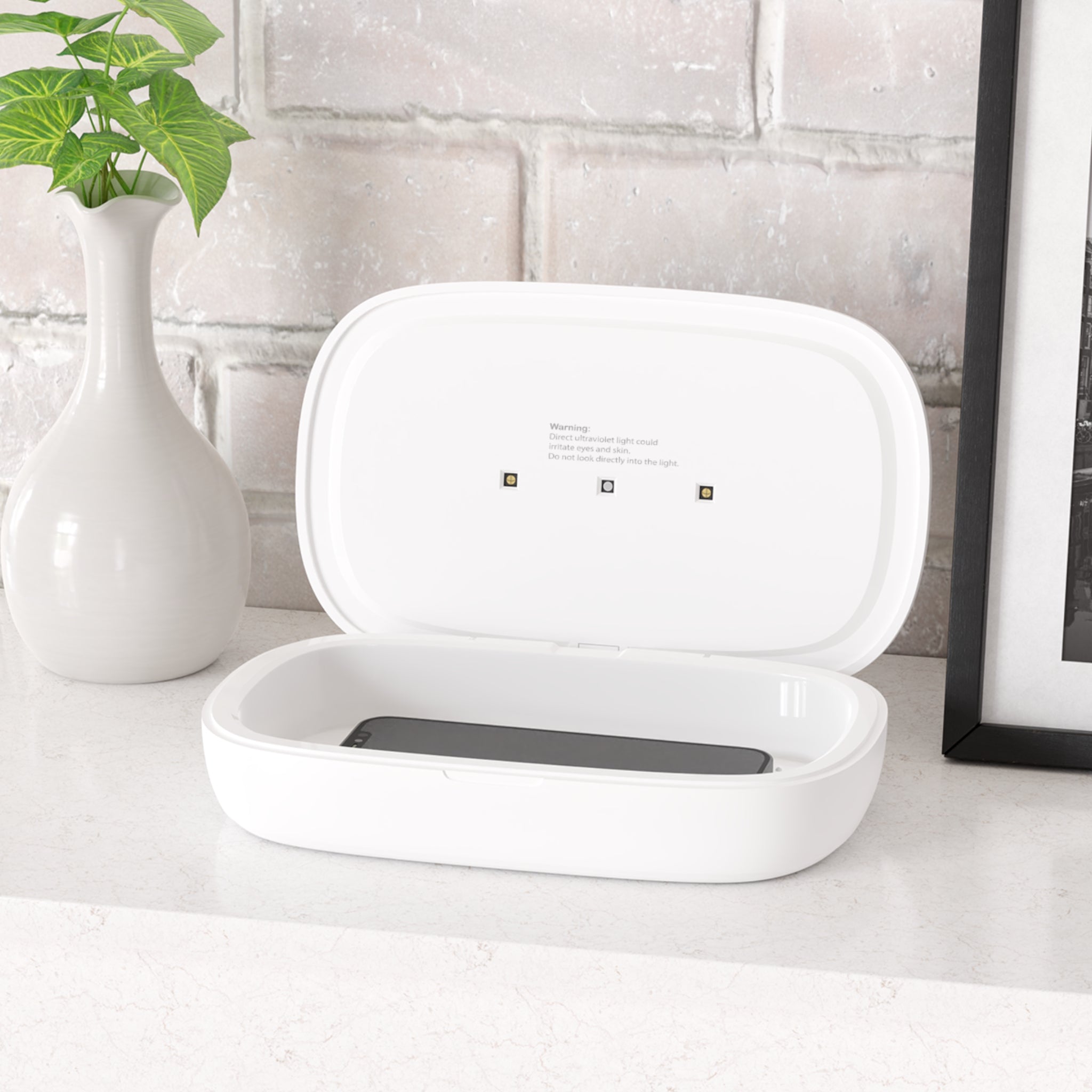 UV sanitizer for phone with a built in charger for 90 second or 5 minute cycle