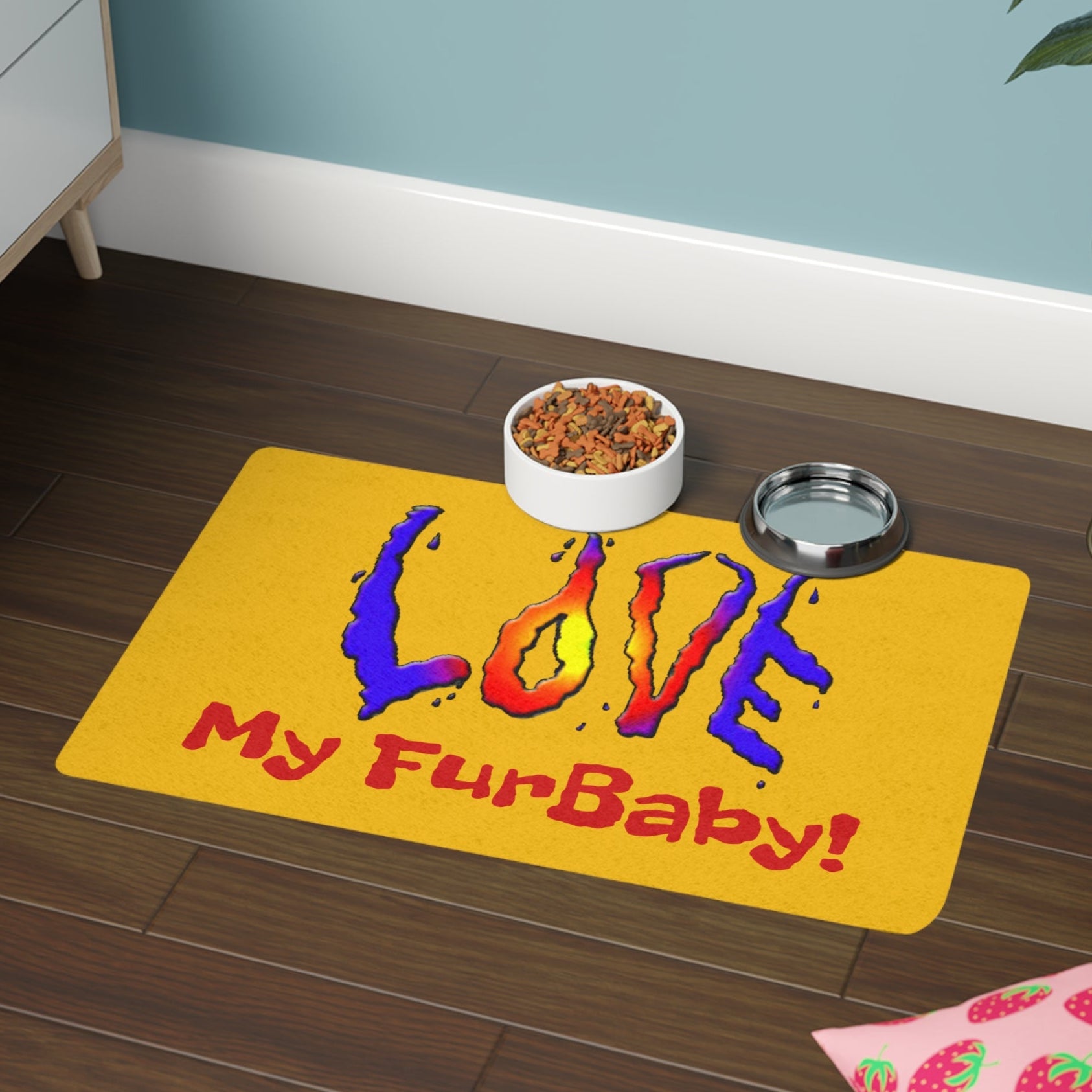 Yellow Food Mat with 'Love My FurBaby!' text on a wooden floor with pet bowls.
