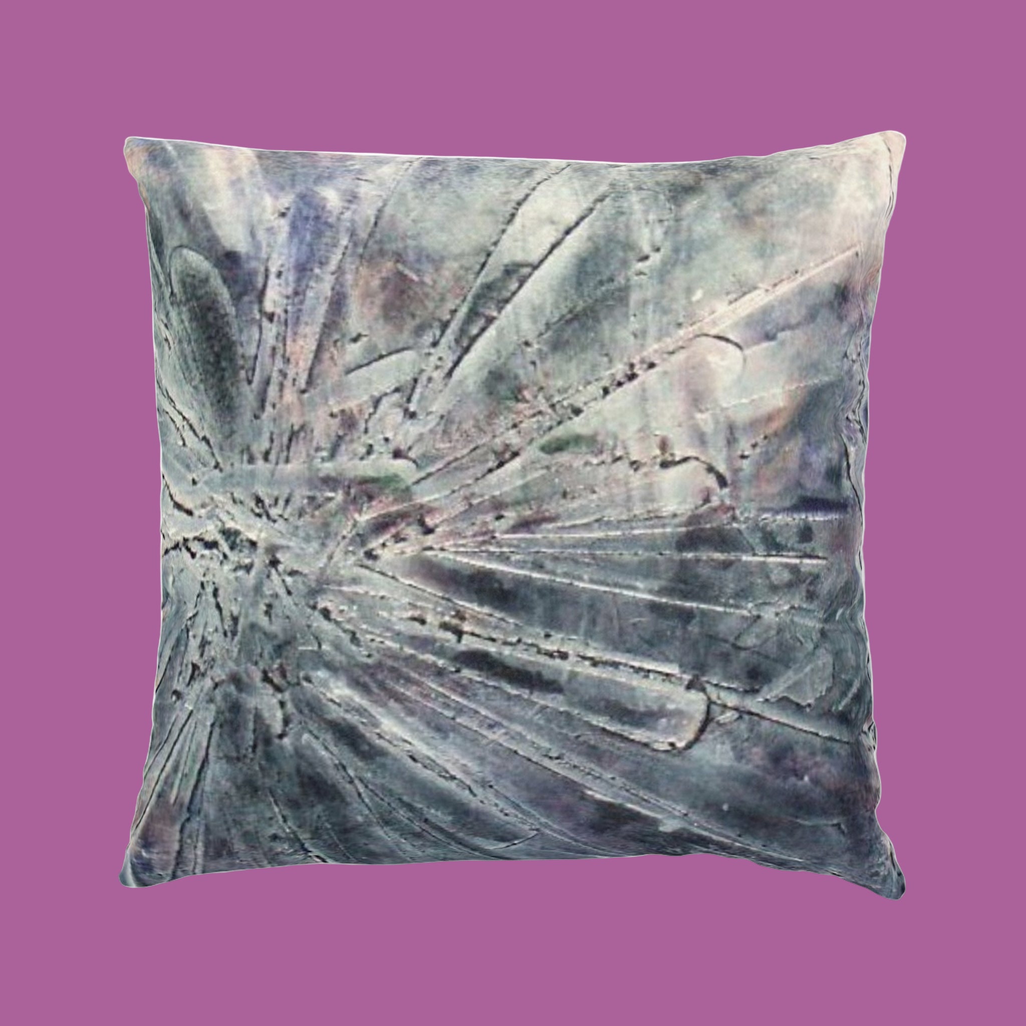 Decorative pillow with abstract with bursts of silvers and greys