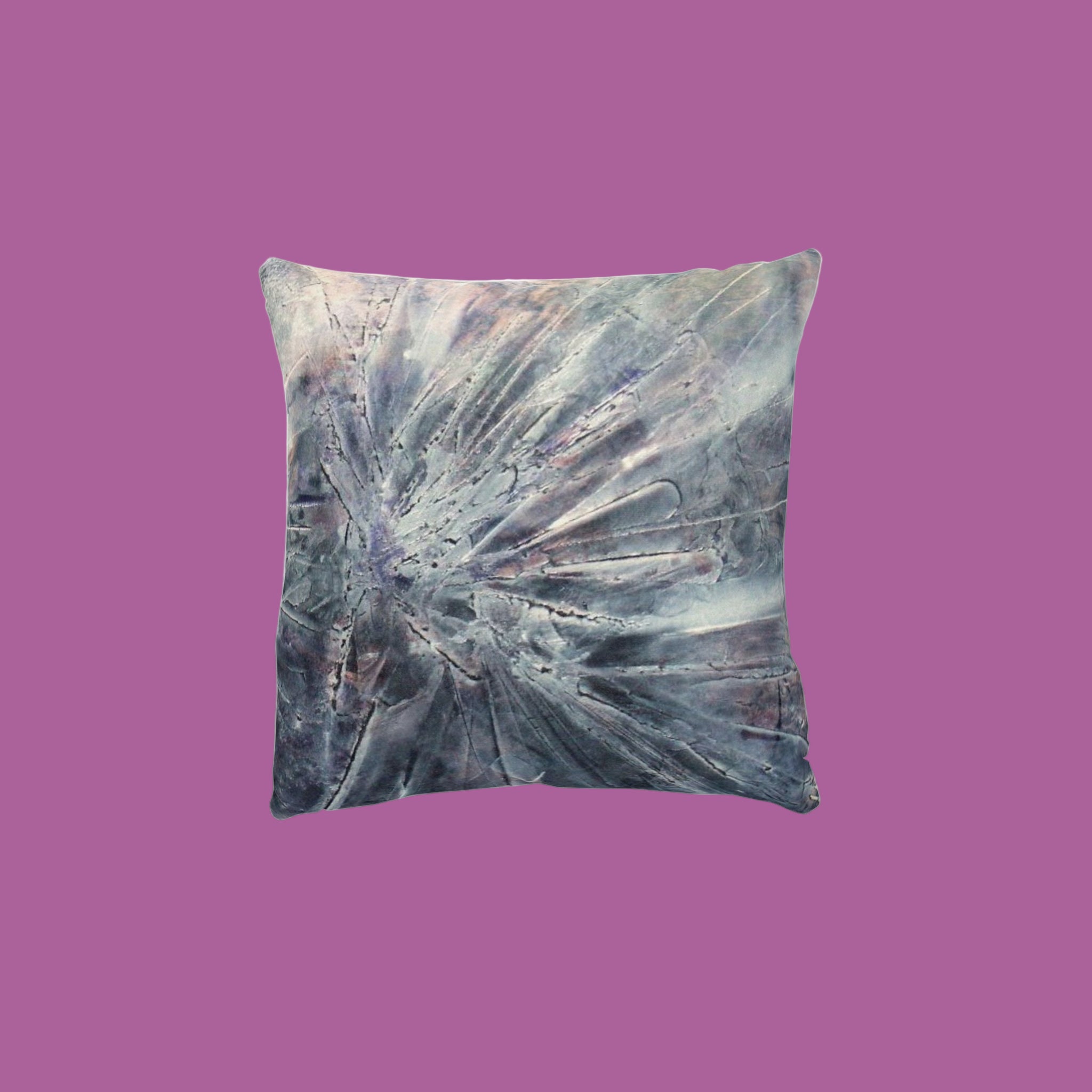 Decorative pillow with abstract design in silver and greys