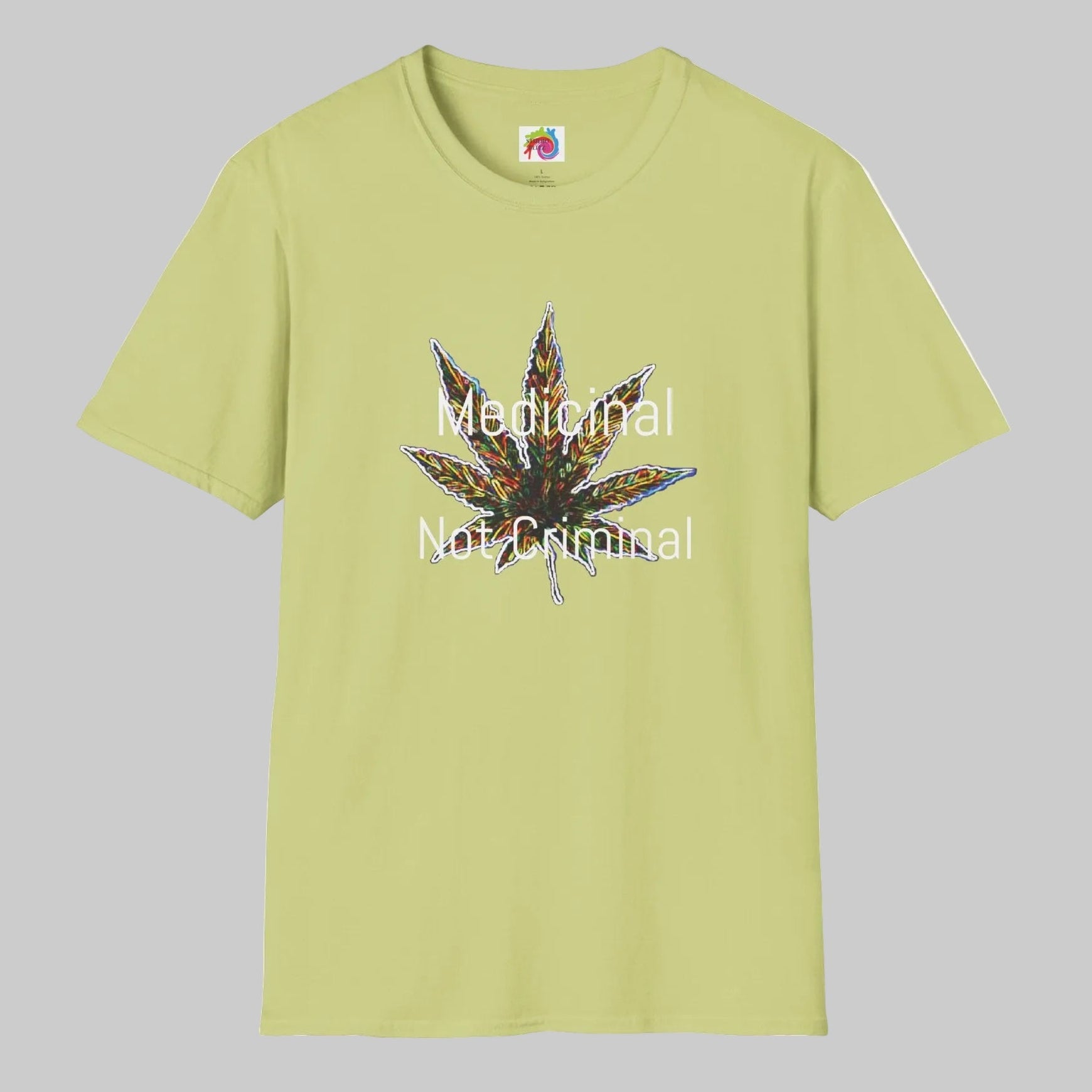 Pistachio colored crewneck t-shirt with a graphic of a cannabis leaf in the center, overlaid with the white text 'Medical Not Criminal'. XS-5XL