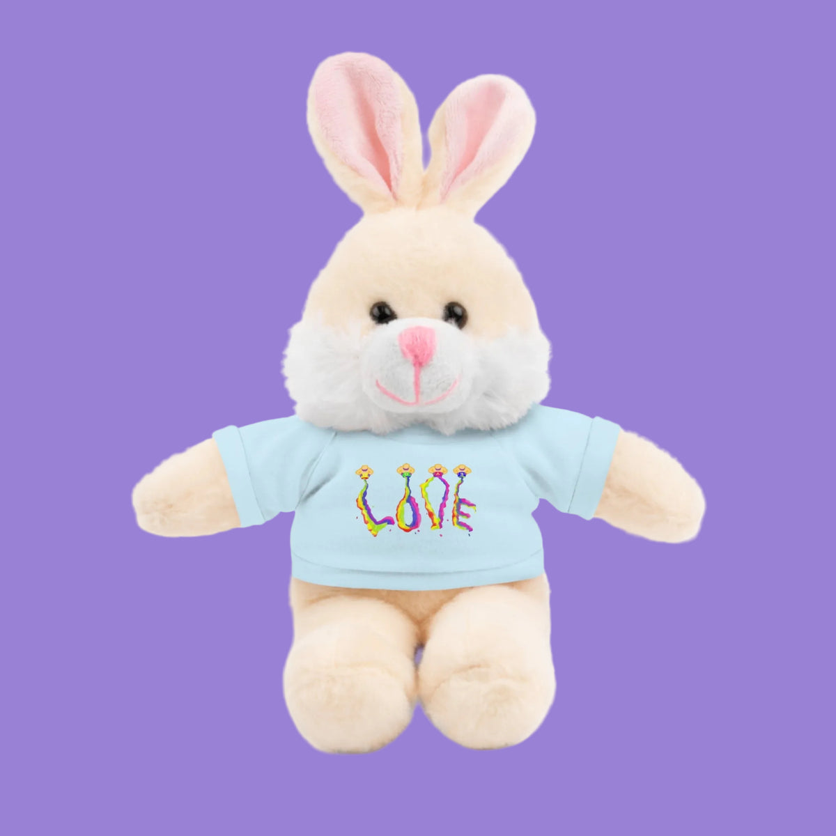 A plush bunny toy with cream-colored fur, pink inner ears, and a light blue shirt featuring the word 'LOVE' in colorful style letters