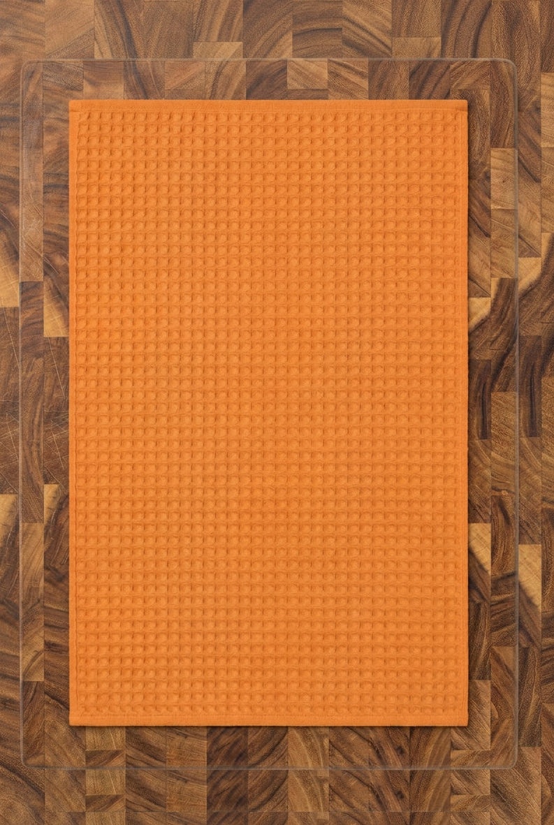 An orange textured rectangular tea towel shows the back of Harvest Tea Towel