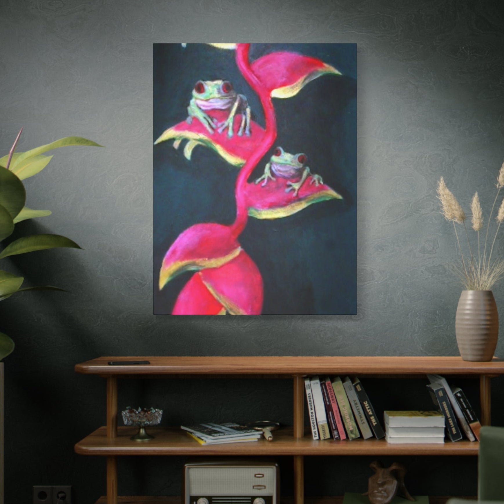 High quality print of frogs on pink a Heliconia plant above a wooden shelf with books and decor.