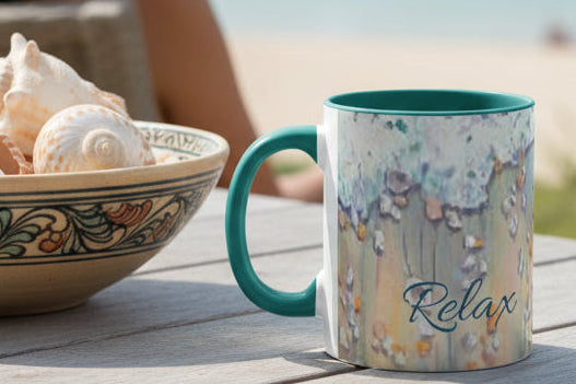 Mug painted with ocean surf design and 'Relax' text and green accent colors