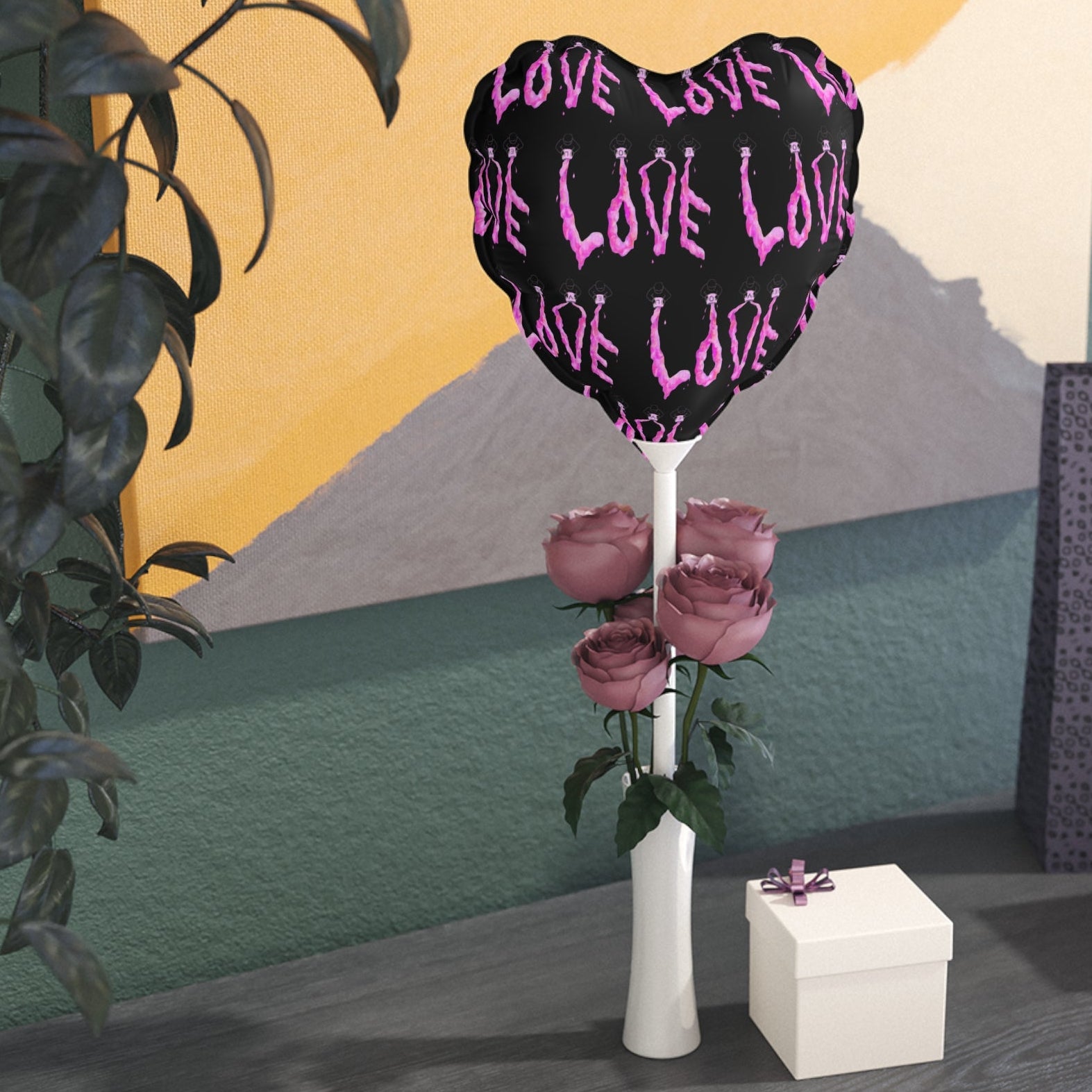 Heart-shaped foil balloon with 'LOVE' text in heart and round shape