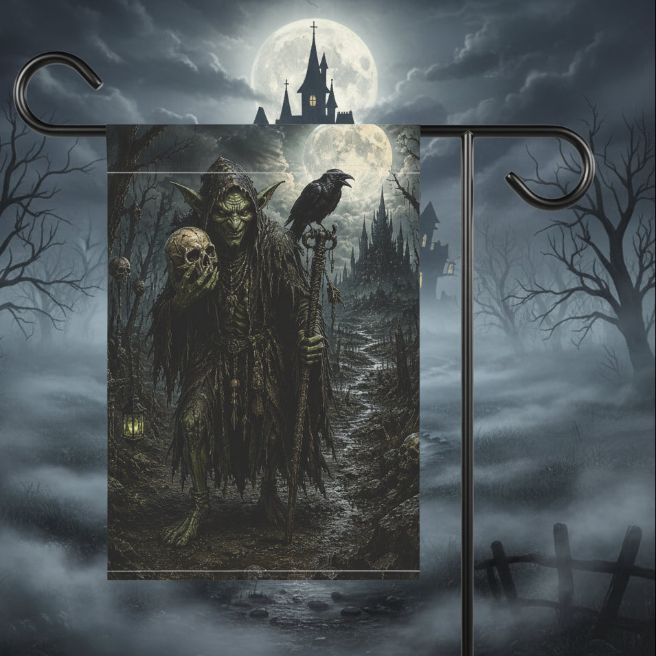 A Halloween garden flag hanging from a black metal stand against a white background. The flag features a dark, gothic illustration of a skeletal goblin holding a skull and staff, with a raven perched on its shoulder and a full moon in the background.