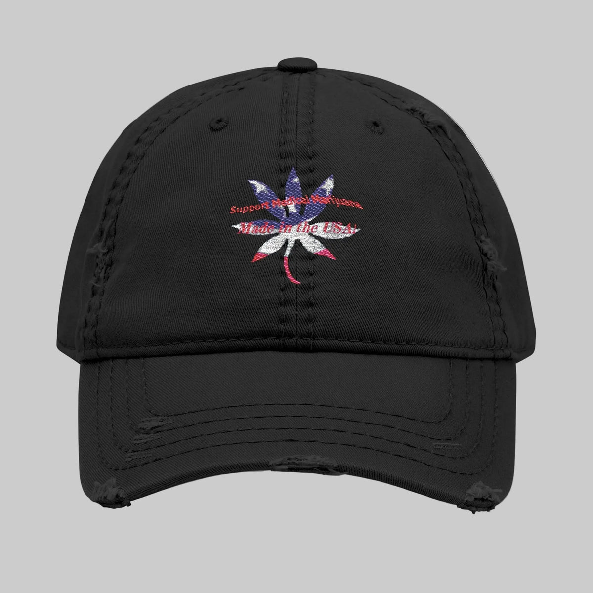 Black cap with a red, white and blue cannabis leaf design and text: Support Medical Marijuana Made in the USA 